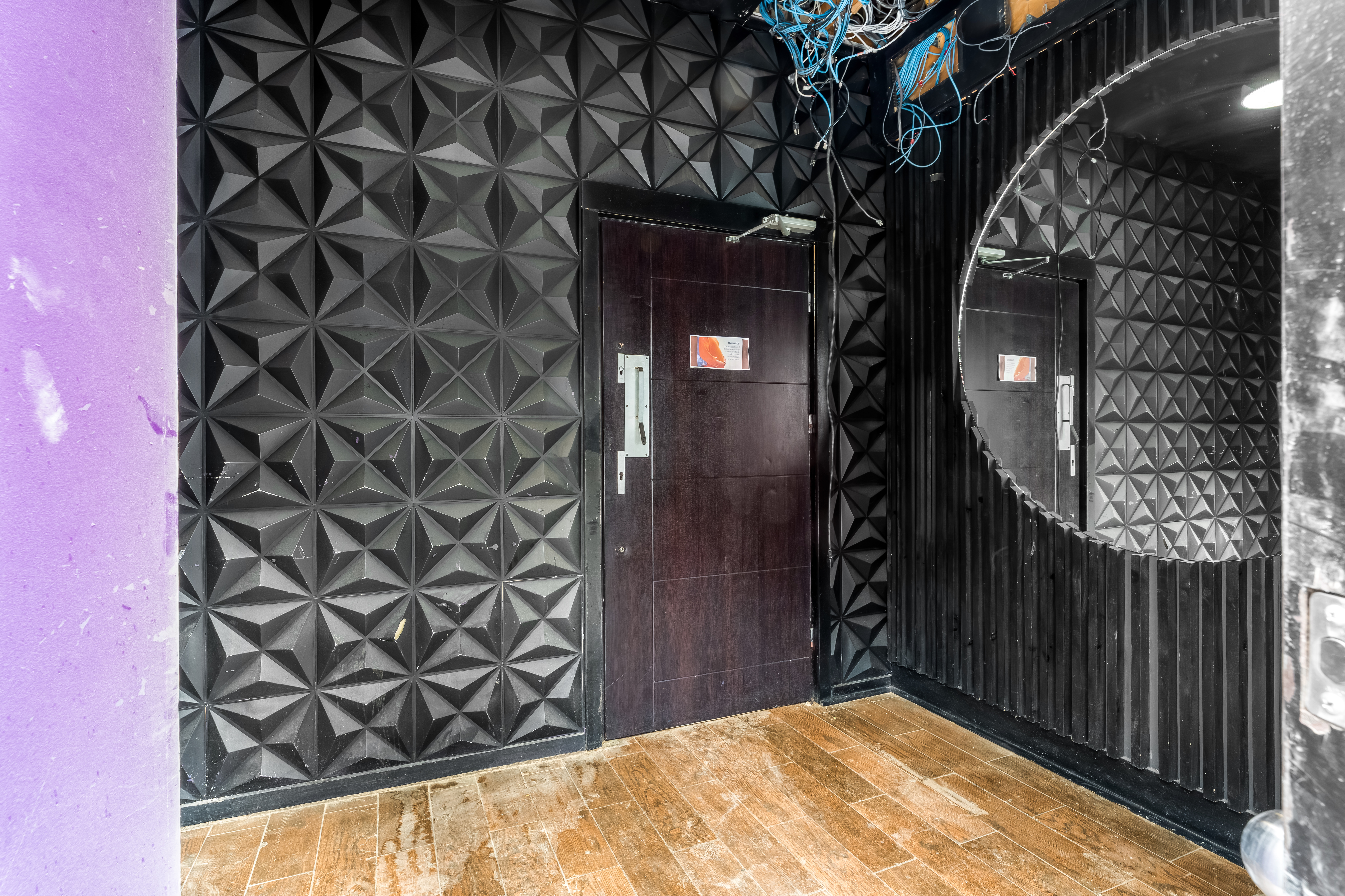 646 Newark Avenue, Unit COMMERCIAL Jersey City, NJ 07306 - Photo 9 of 35 a view of a wooden door and brick wall