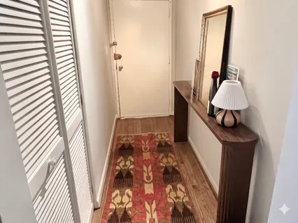 a bedroom with a bed and a mirror