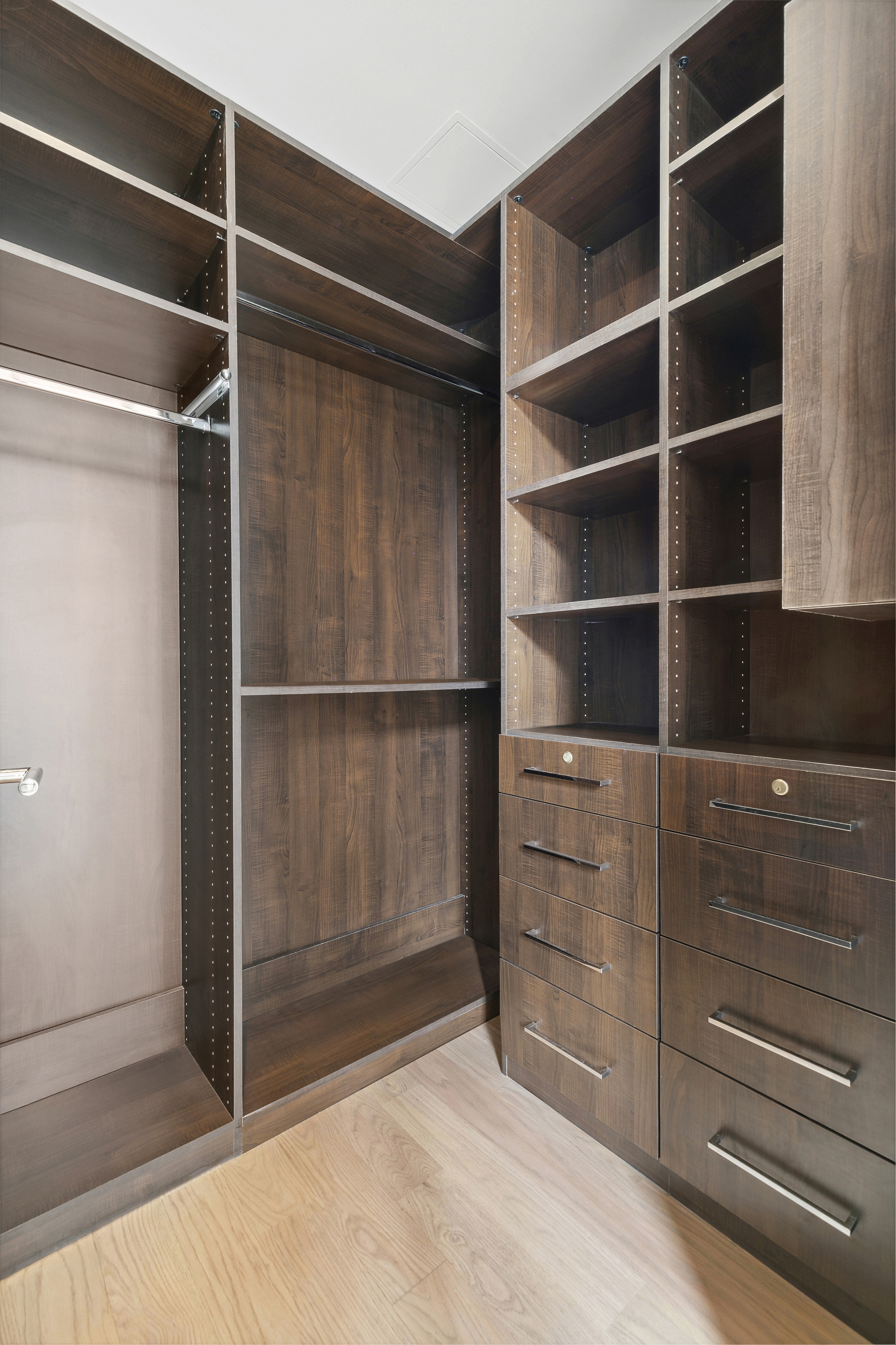 254 Park Avenue South, Unit 3C Manhattan, NY 10010 - Photo 7 of 9 a view of walk in closet with empty racks