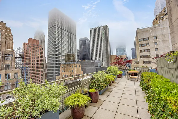99 John Street, Unit 1101 Manhattan, NY 10038 - Photo 11 of 16 a view of lot of flower pots