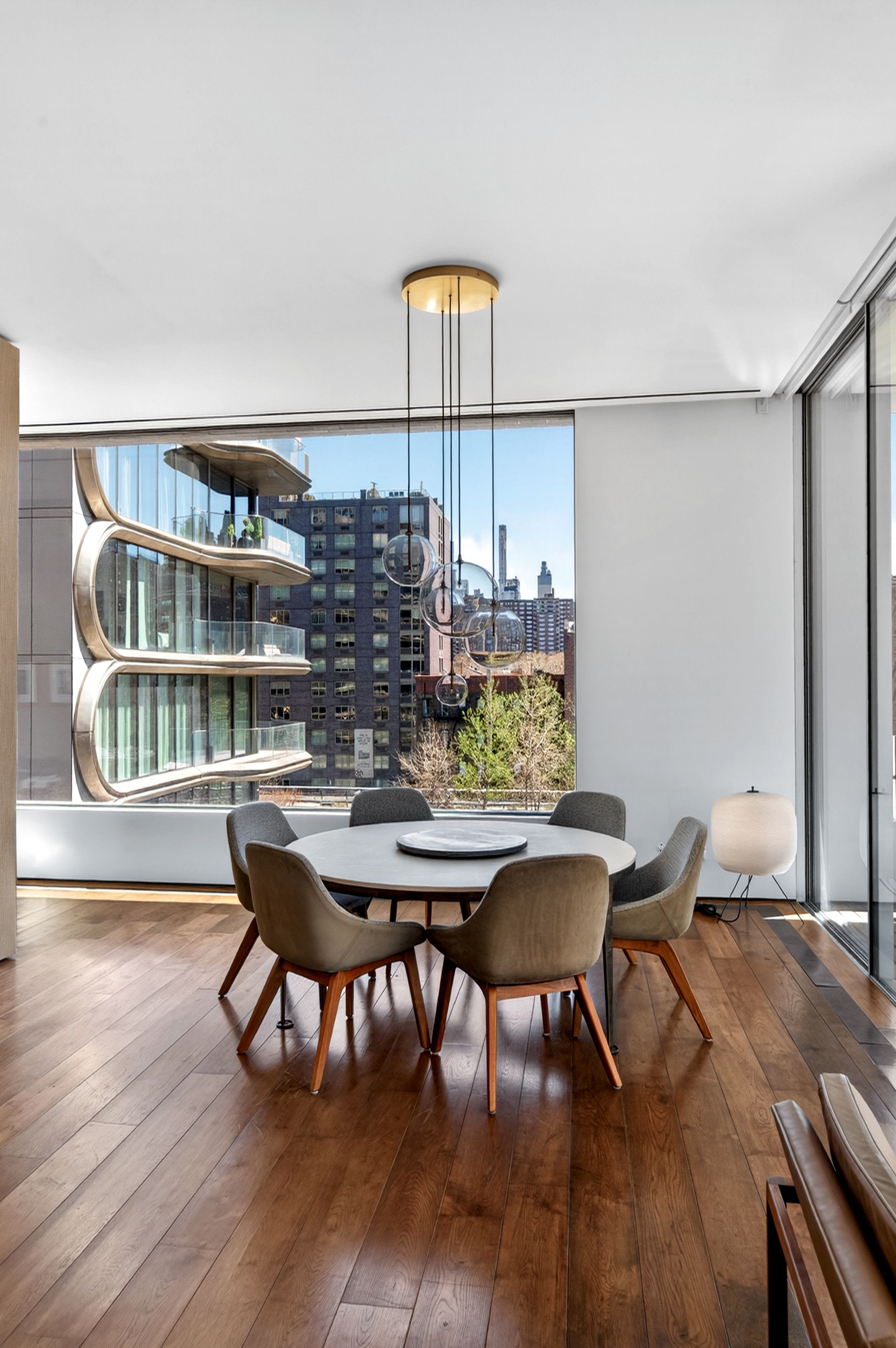 527 West 27th Street, Unit 6S Manhattan, NY 10001 - Photo 2 of 19 a view of a dining room with furniture and wooden floor