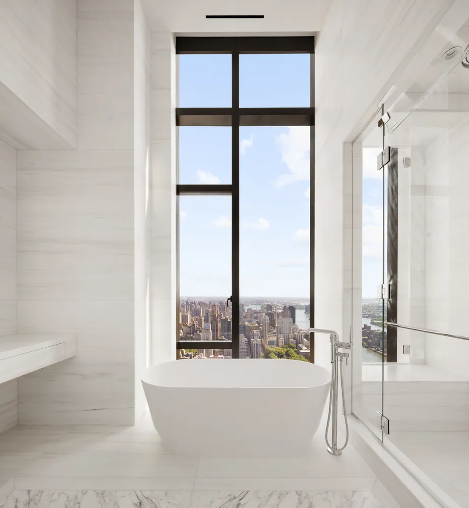 a bathroom with a bathtub and shower