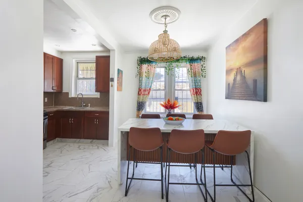 a view of a kitchen and dining room