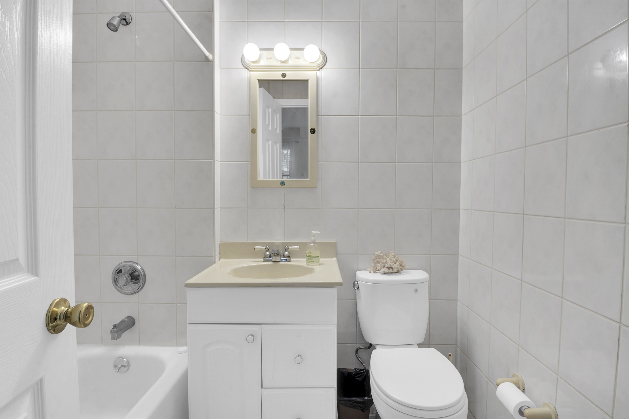 131 Jansen Street Staten Island, NY 10312 - Photo 18 of 21 a bathroom with a sink a toilet and shower