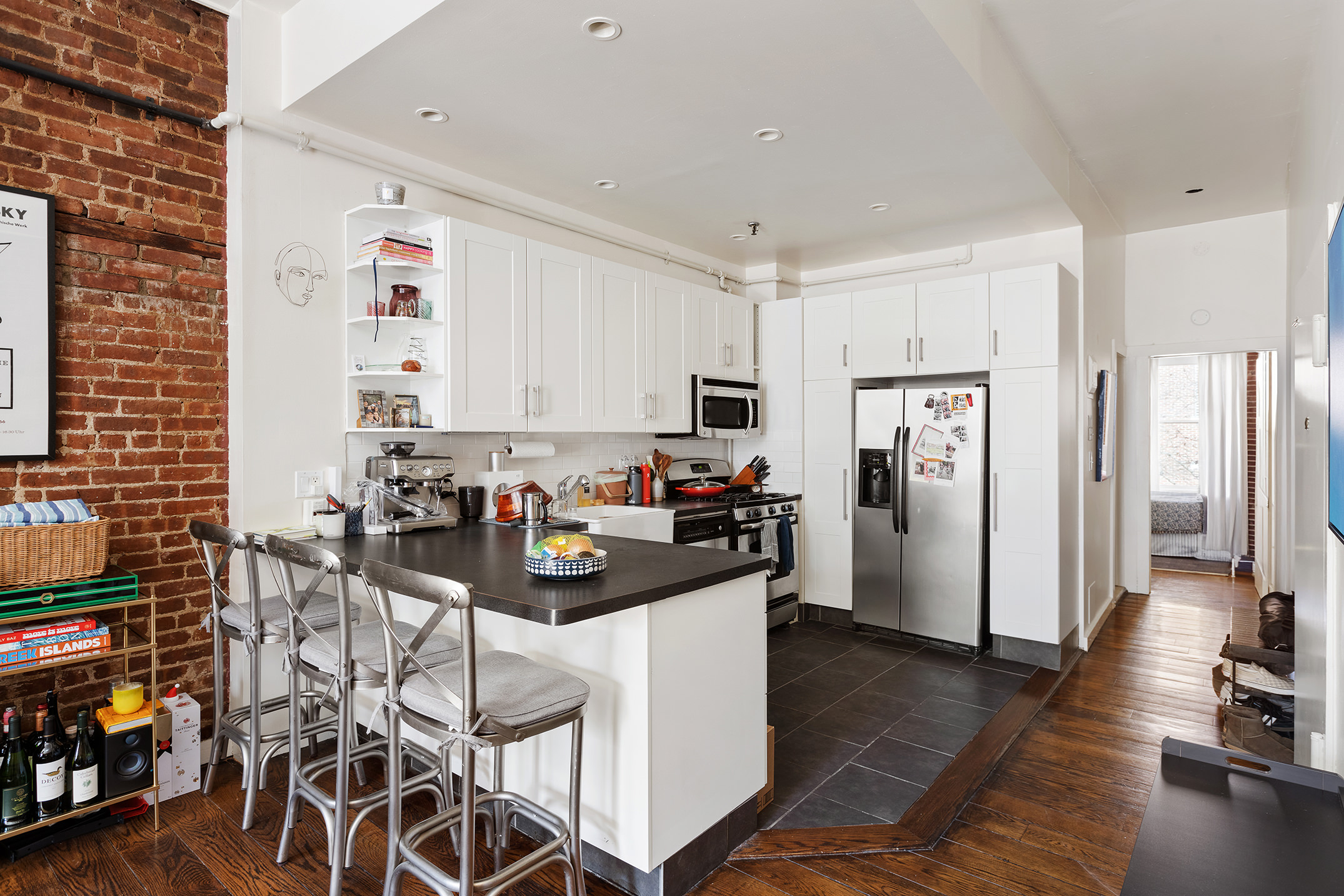 138 West 73rd Street Manhattan, NY 10023 - Photo 21 of 35 a living room with furniture and a flat screen tv