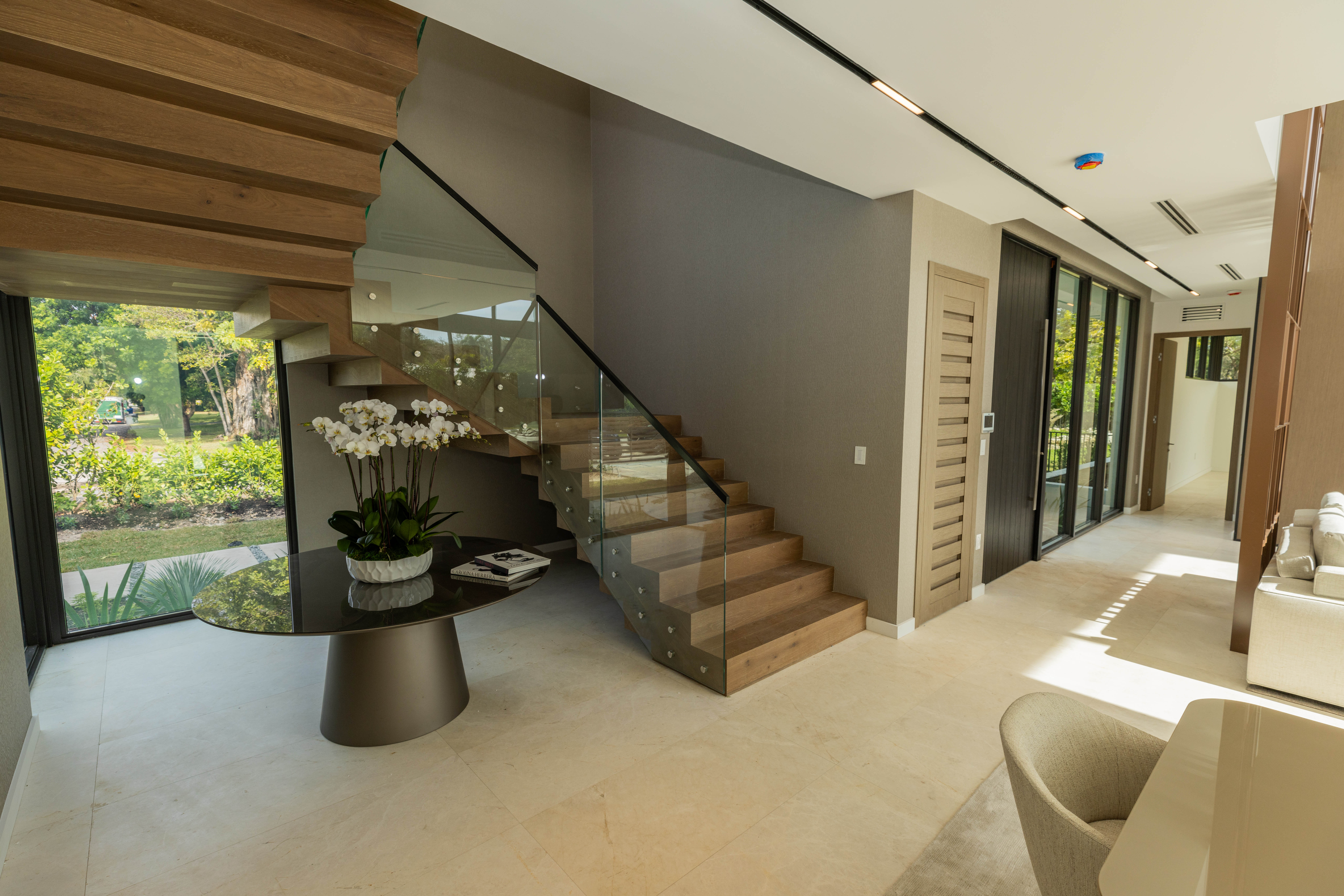 6920 Southwest 124th Street Pinecrest, FL 33156 - Photo 16 of 48 a view of entryway and hall with wooden floor