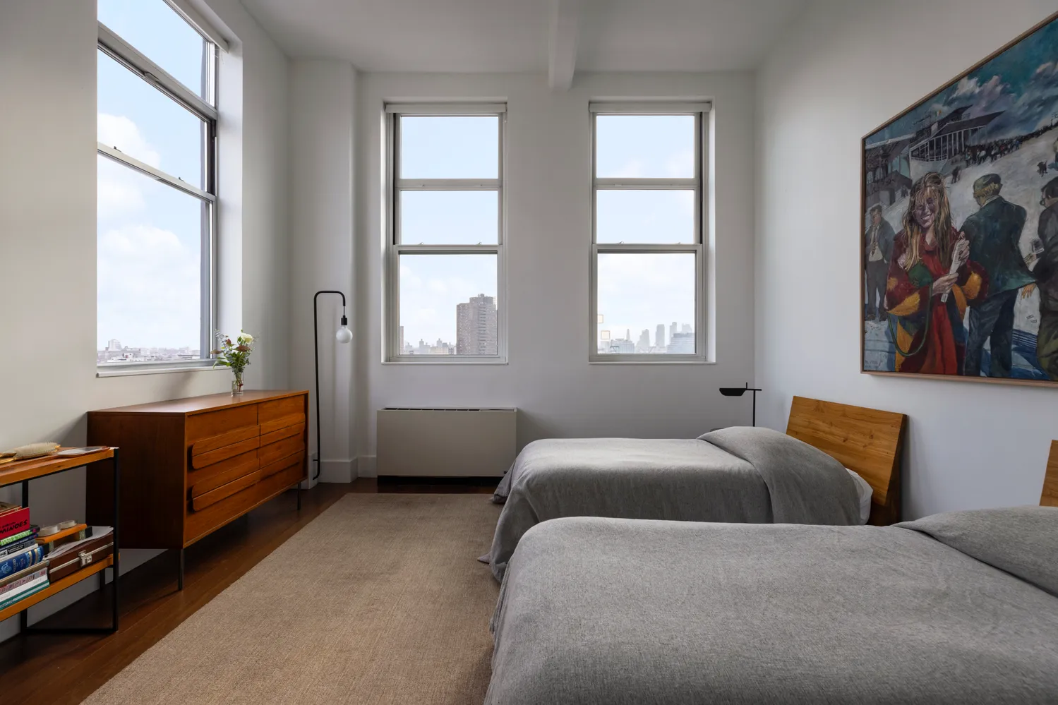 a bedroom with furniture and a window