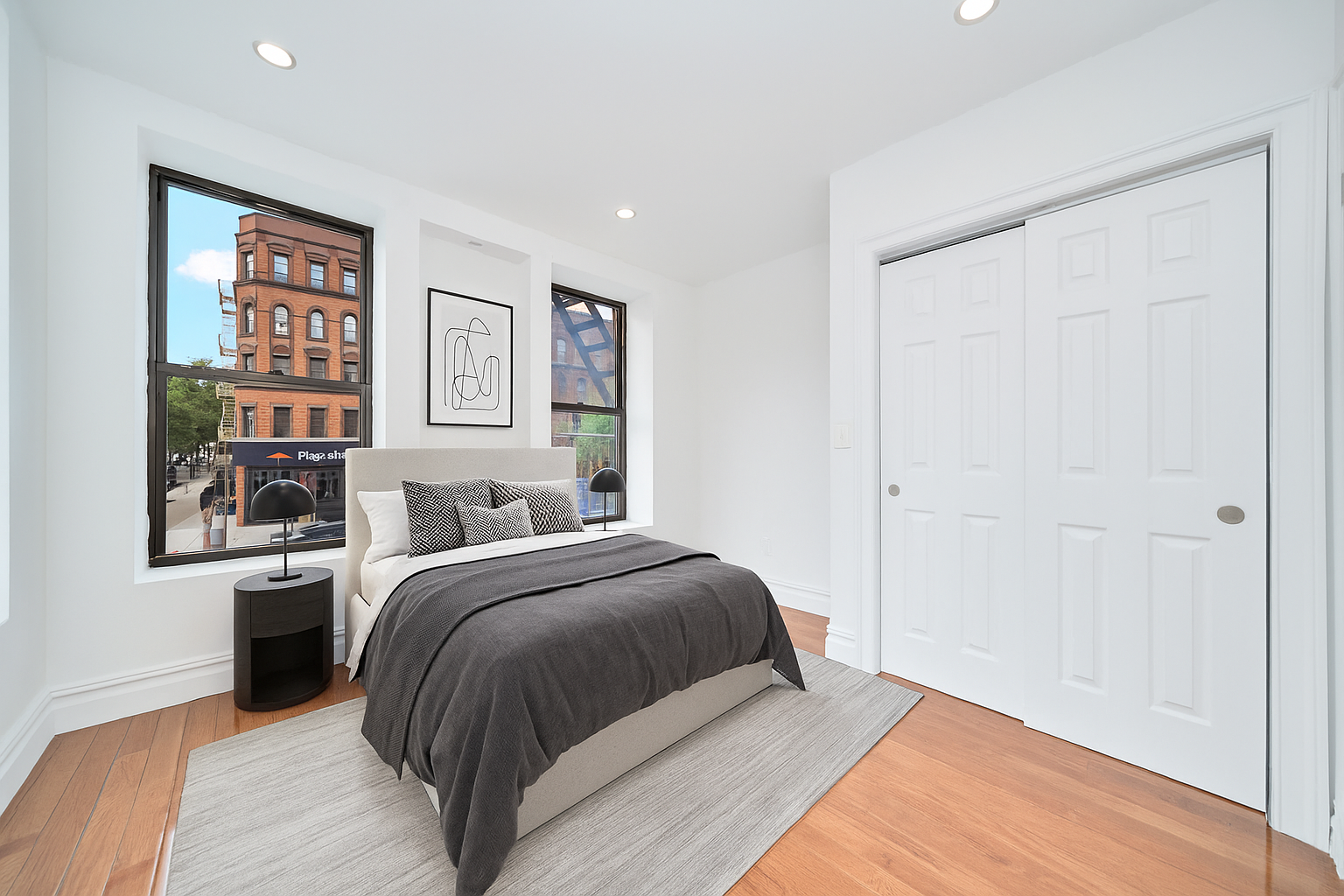 941 Columbus Avenue, Unit 1A Manhattan, NY 10025 - Photo 3 of 14 a bedroom with a large bed and a window