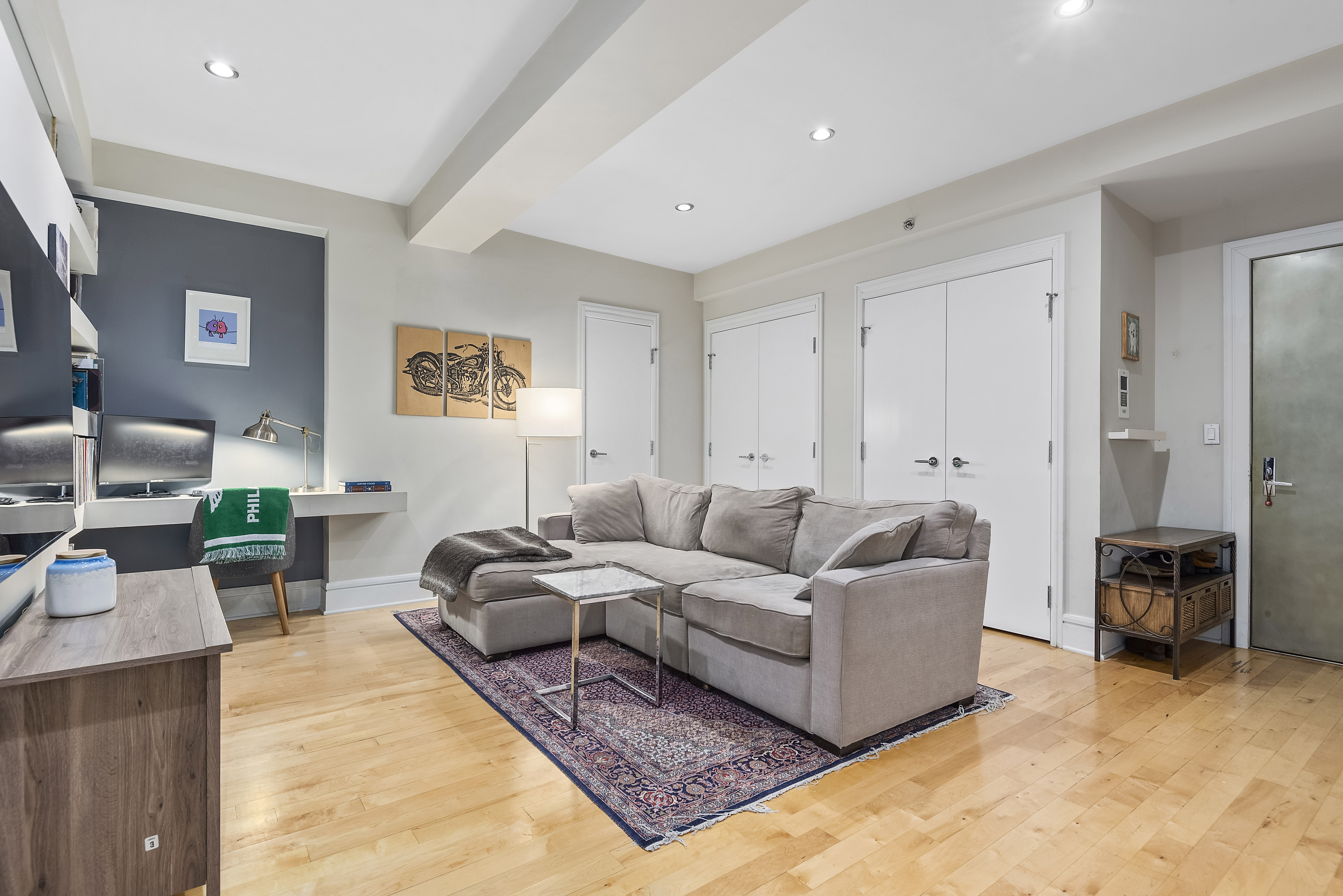 57 Front Street, Unit 305 Brooklyn, NY 11201 - Photo 2 of 10 a living room with furniture and a couch