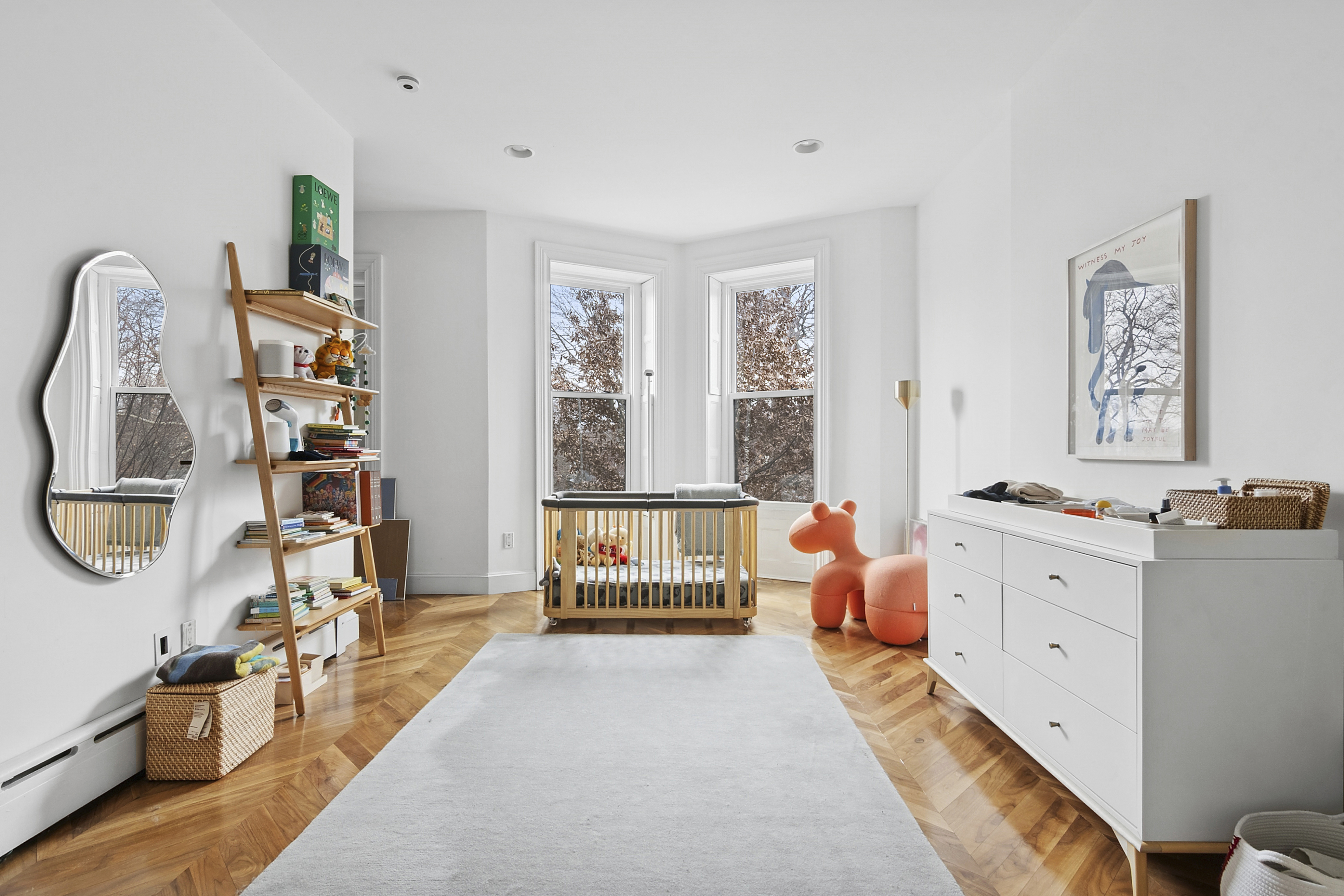 581 Greene Avenue, Unit 2 Brooklyn, NY 11216 - Photo 8 of 16 a bedroom with furniture and a large window