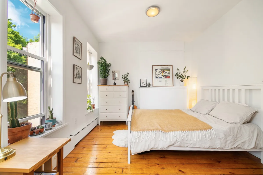 464 Macon Street, Unit 2 Brooklyn, NY 11233 - Photo 5 of 9 a bedroom with a bed and a couch