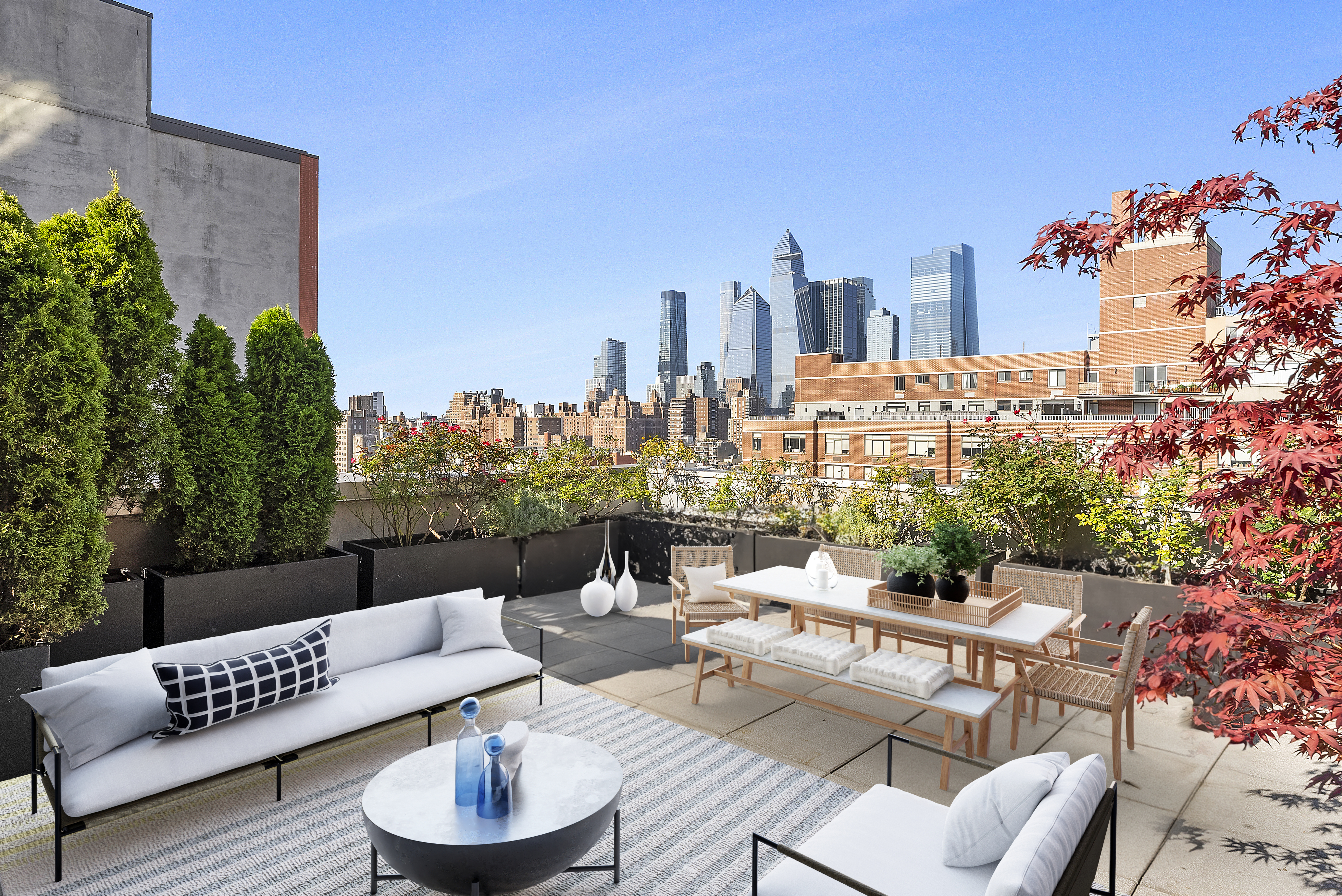 224 West 18th Street, Unit PHA Manhattan, NY 10011 - Photo 15 of 24 a view of a roof deck with couches and potted plants
