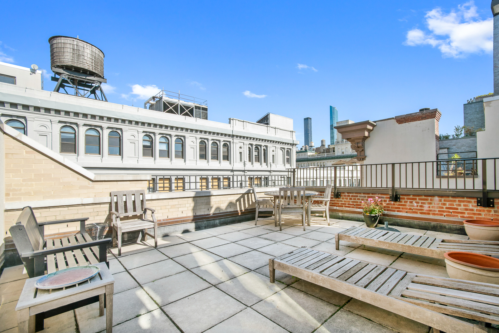 120 West 18th Street, Unit 2A Manhattan, NY 10011 - Photo 13 of 14 a view of a building from a lounge chairs