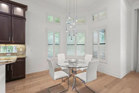 a view of a dining room with furniture and window