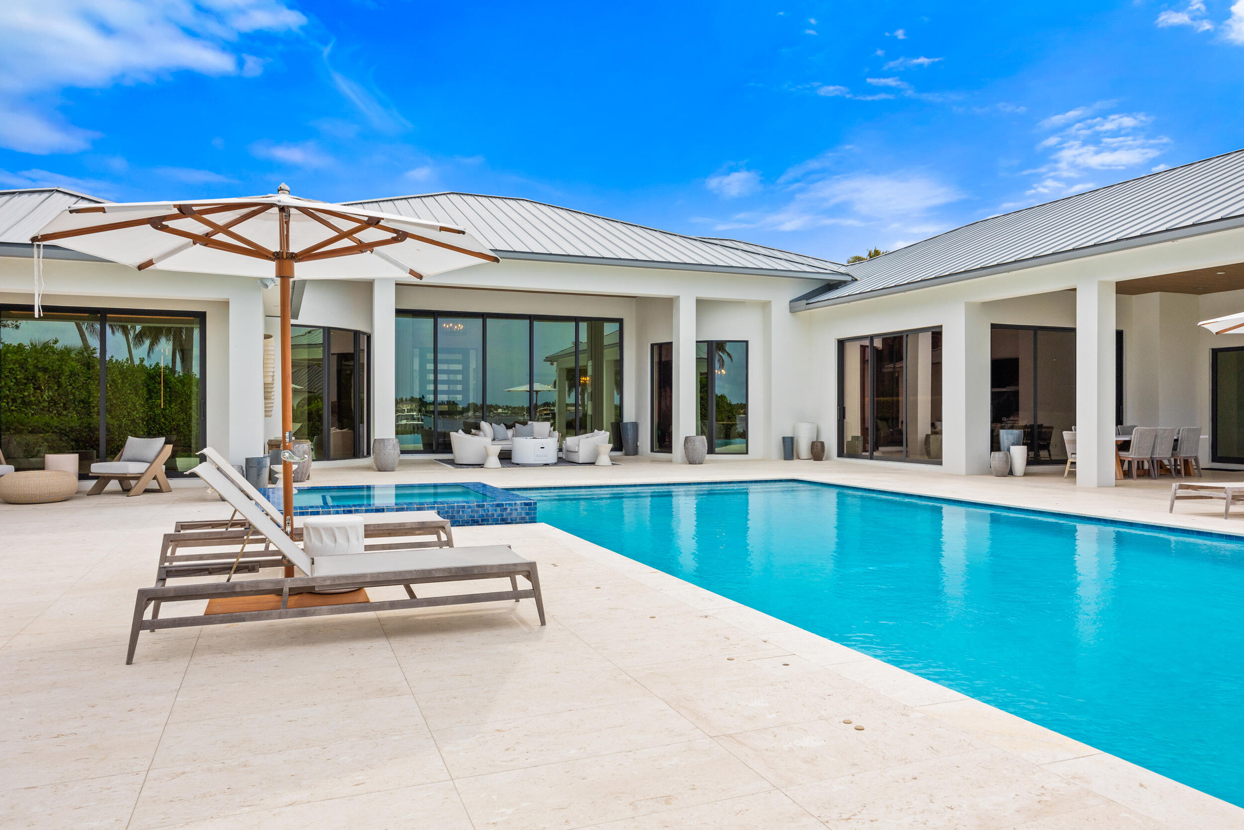 5695 Pennock Point Road Jupiter, FL 33458 - Photo 14 of 77 a view of a patio with swimming pool table and chairs