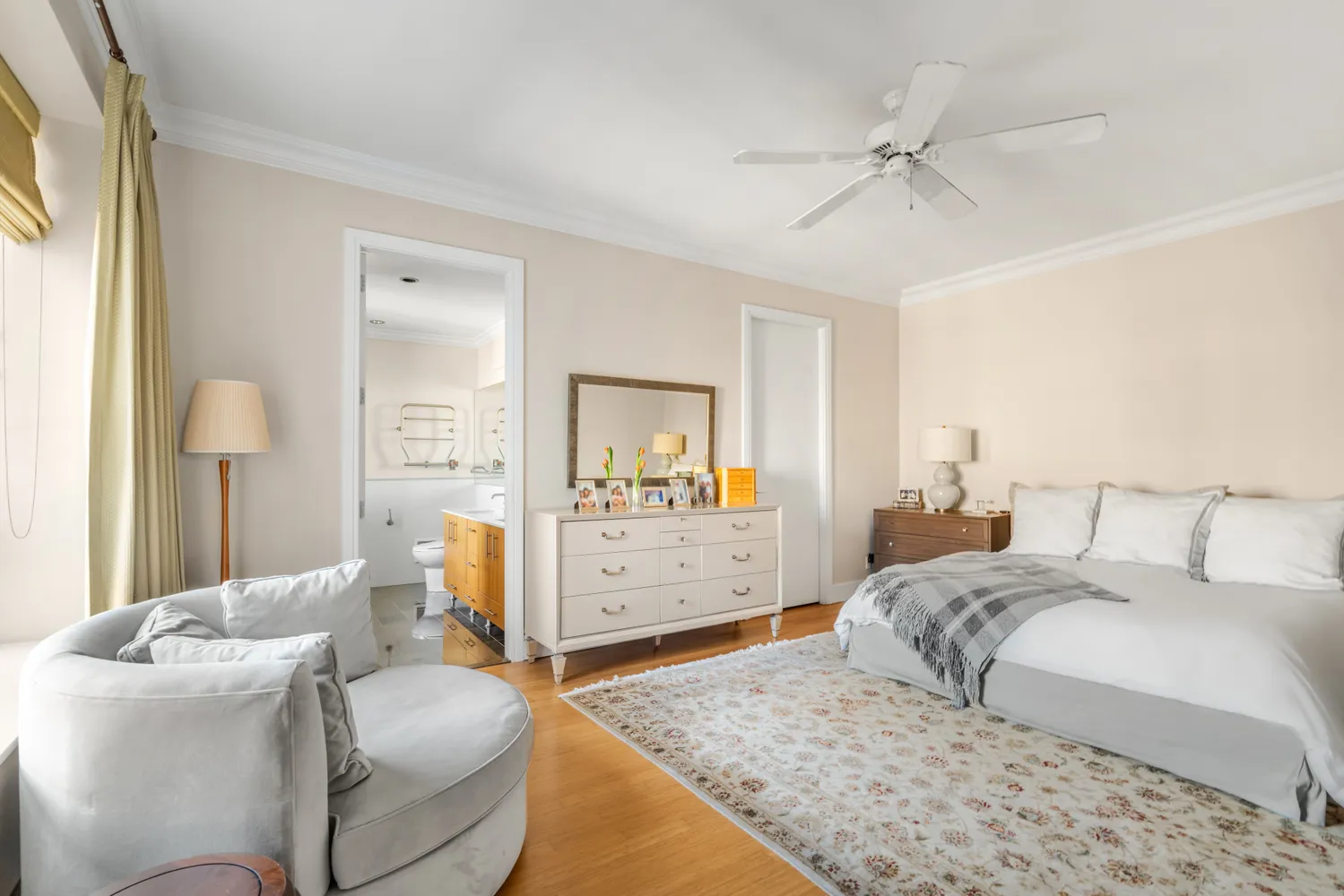 a bedroom with a bed and a dresser