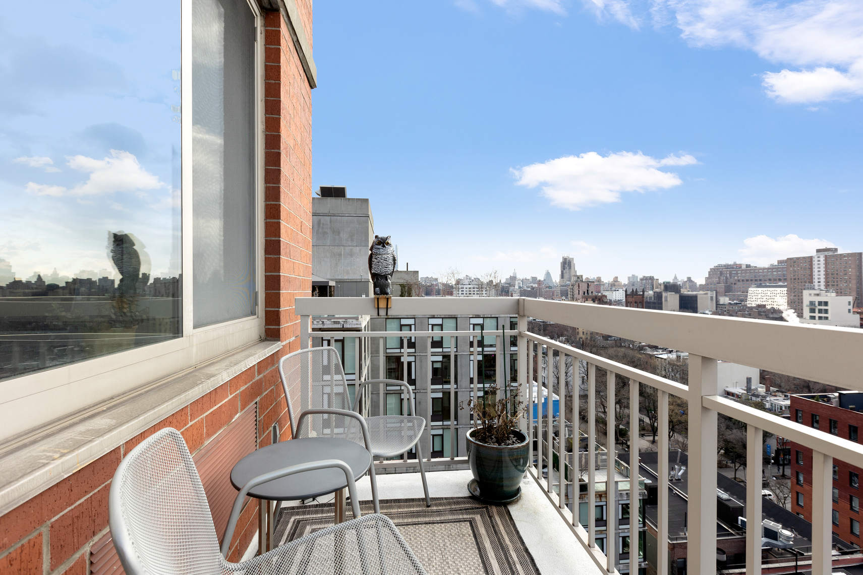 520 West 23rd Street, Unit PH16F Manhattan, NY 10011 - Photo 9 of 17 a view of a balcony with a table and chairs