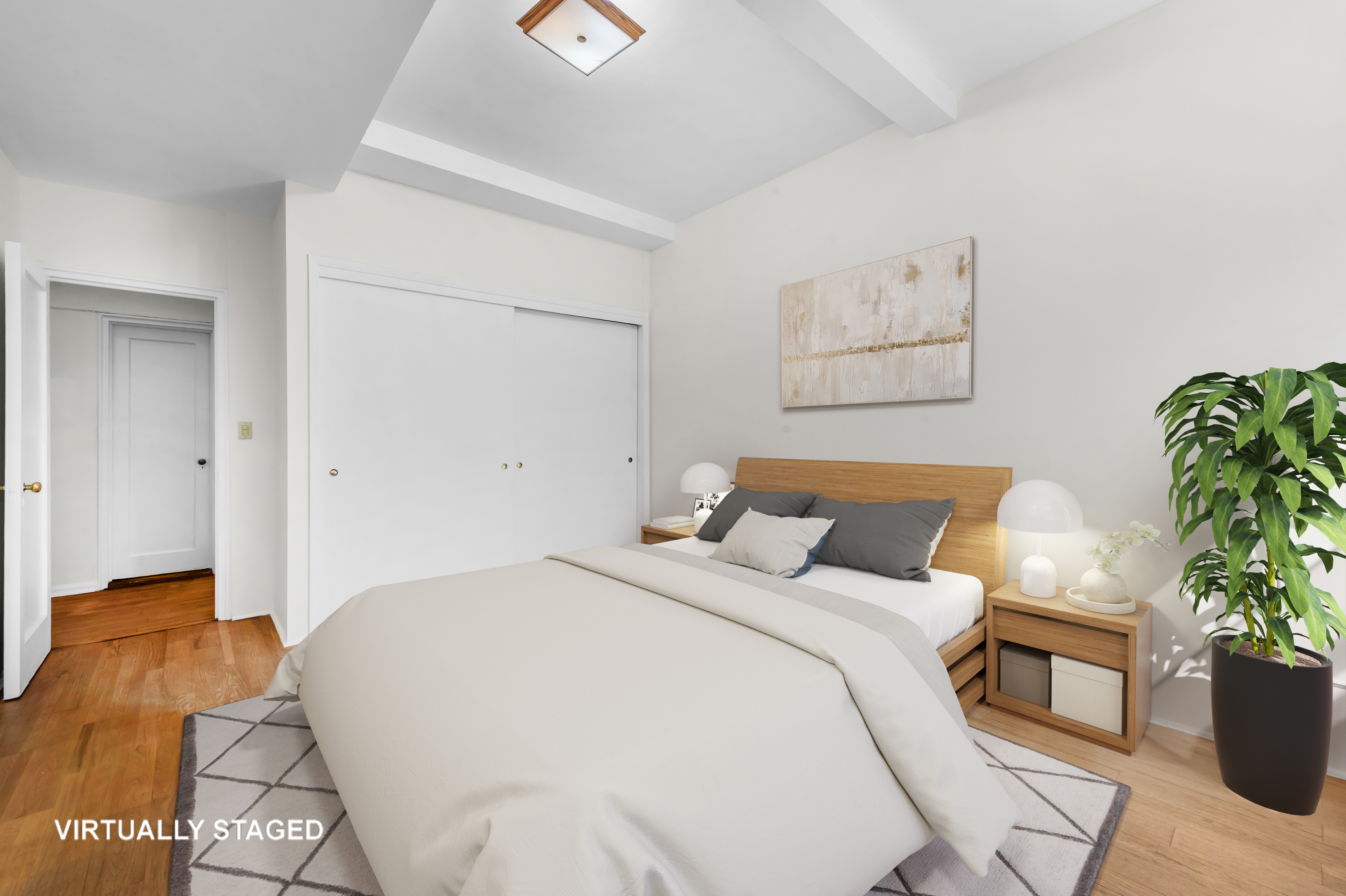 263 West End Avenue, Unit 5B Manhattan, NY 10023 - Photo 7 of 9 a bedroom with a bed and a potted plant