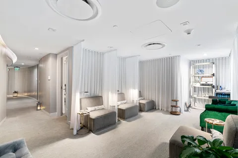 a front view of building with outdoor space and seating