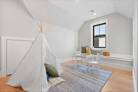 a living room with furniture and a rug