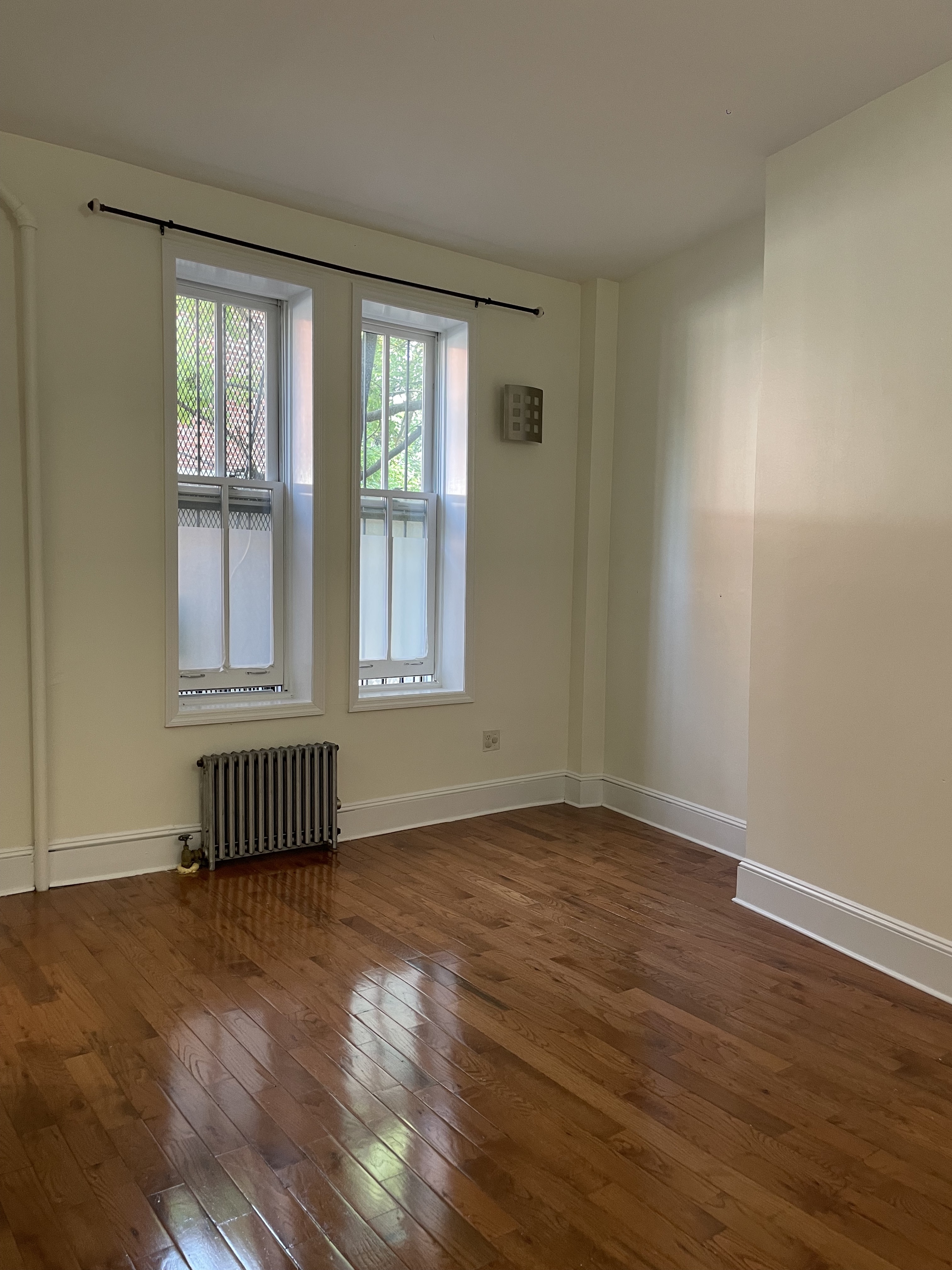 263 Adelphi Street, Unit 1 Brooklyn, NY 11205 - Photo 10 of 14 a view of an empty room with wooden floor