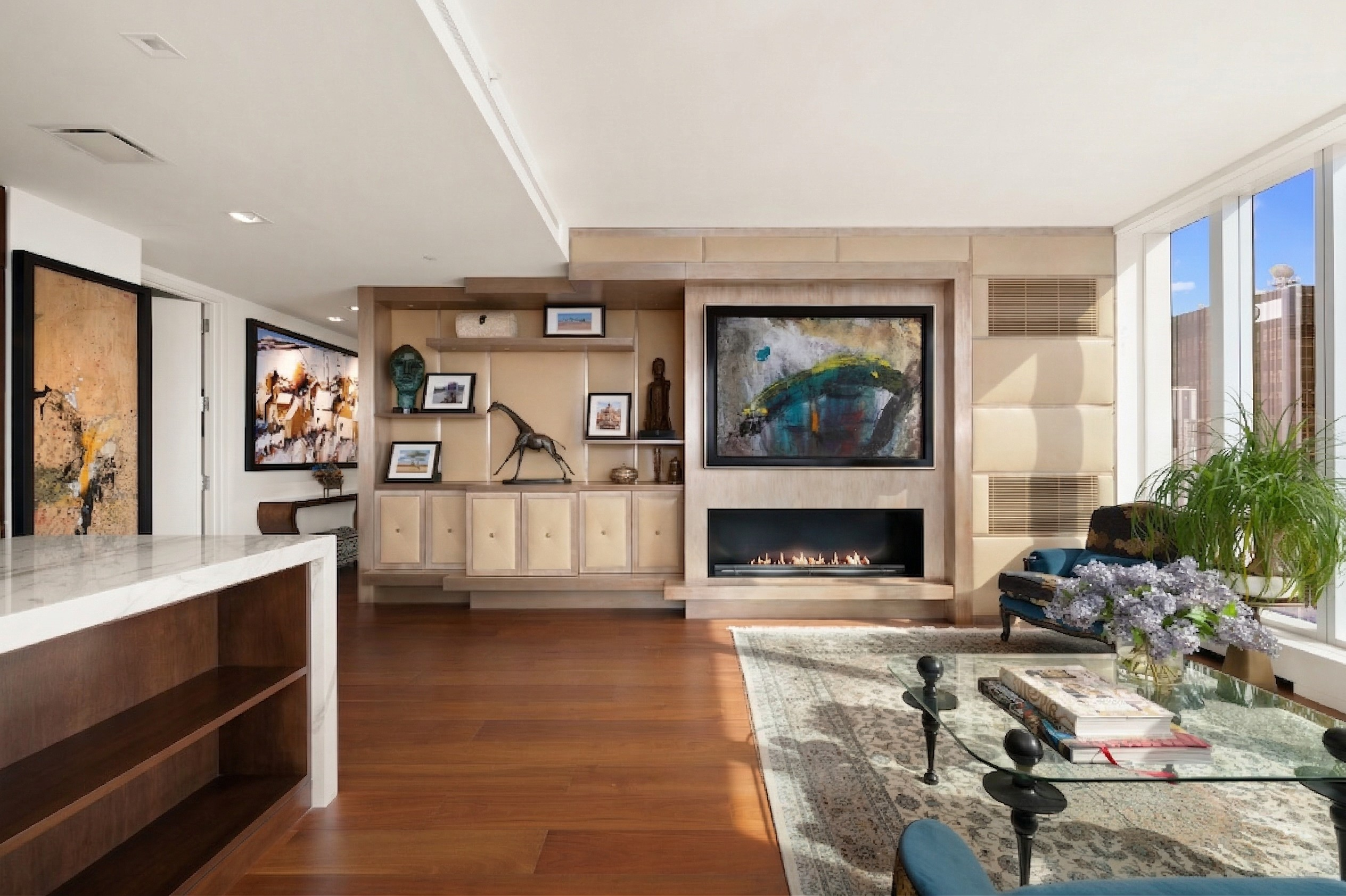 1 West End Avenue, Unit 19J Manhattan, NY 10023 - Photo 4 of 32 a living room with furniture and a fireplace