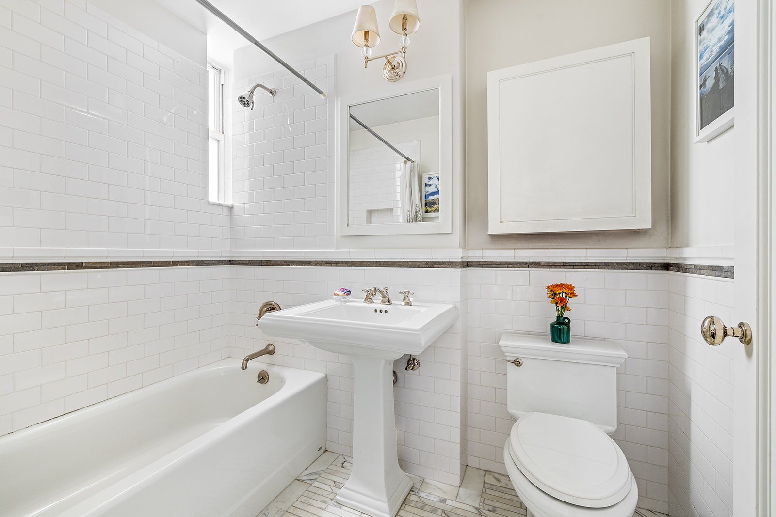 610 West 110th Street, Unit 4D Manhattan, NY 10025 - Photo 8 of 12 a bathroom with a sink a toilet and bathtub