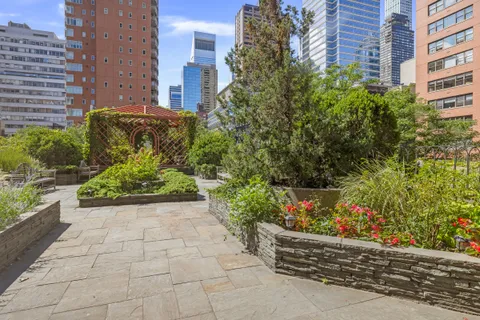 a view of a back yard of the house and a yard