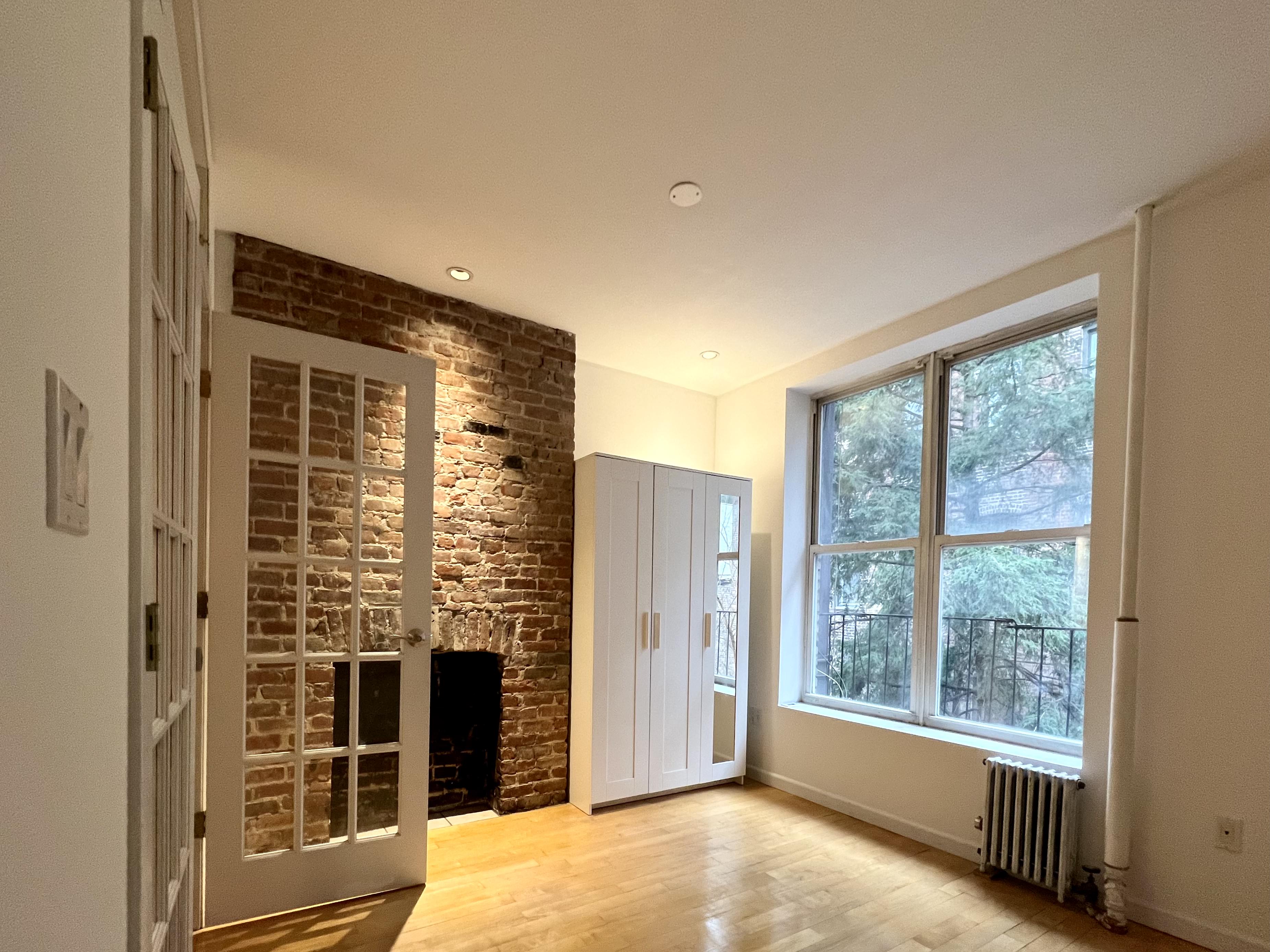 528 West 46th Street, Unit 3E Manhattan, NY 10036 - Photo 4 of 7 a view of an empty room with a window
