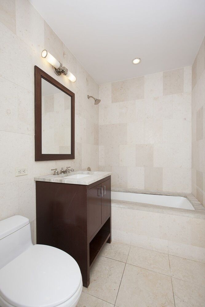100 Riverside Boulevard, Unit 9D Manhattan, NY 10069 - Photo 4 of 14 a bathroom with a toilet a sink and mirror