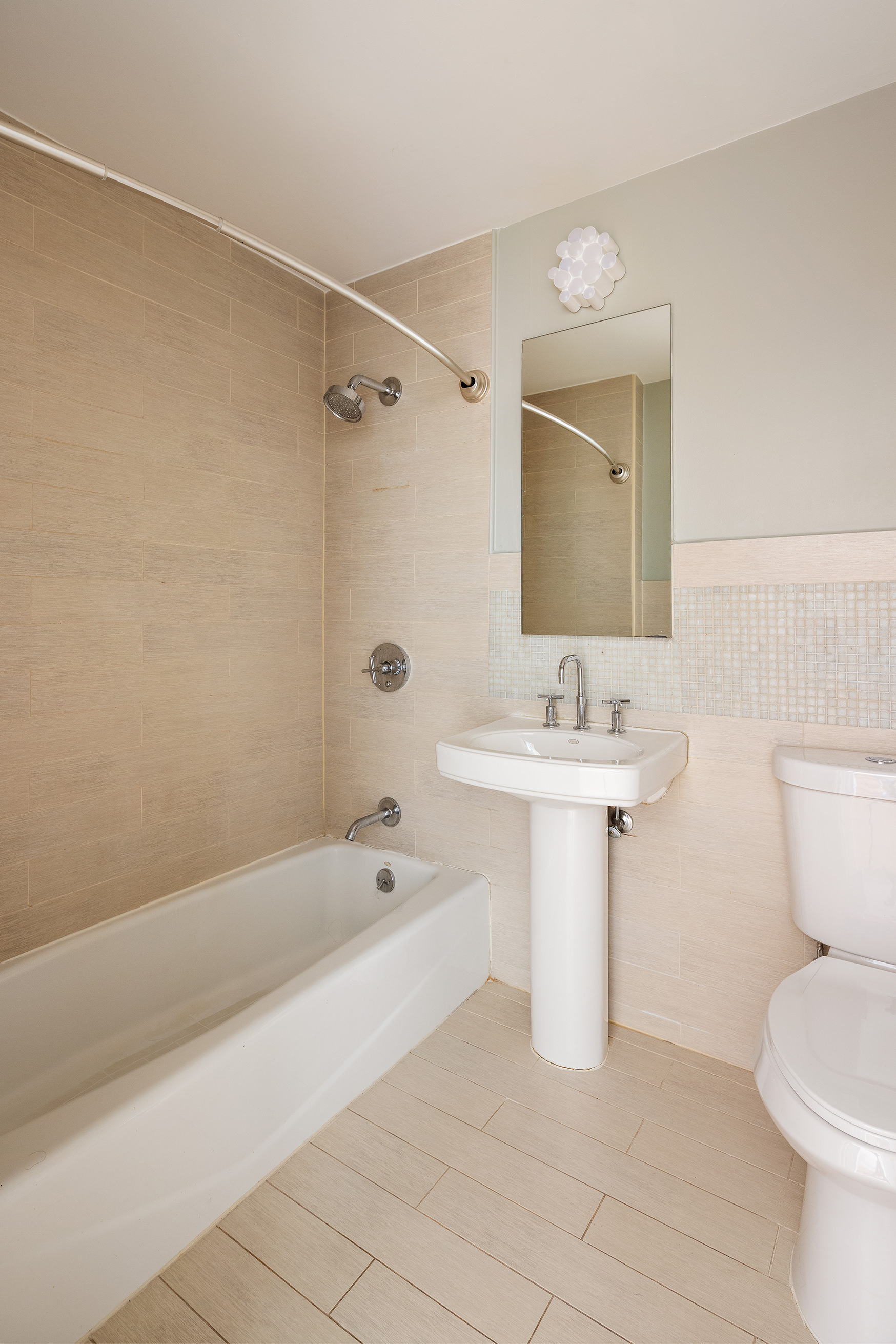 315 20th Street, Unit 3B Brooklyn, NY 11215 - Photo 6 of 9 a bathroom with a sink toilet and shower