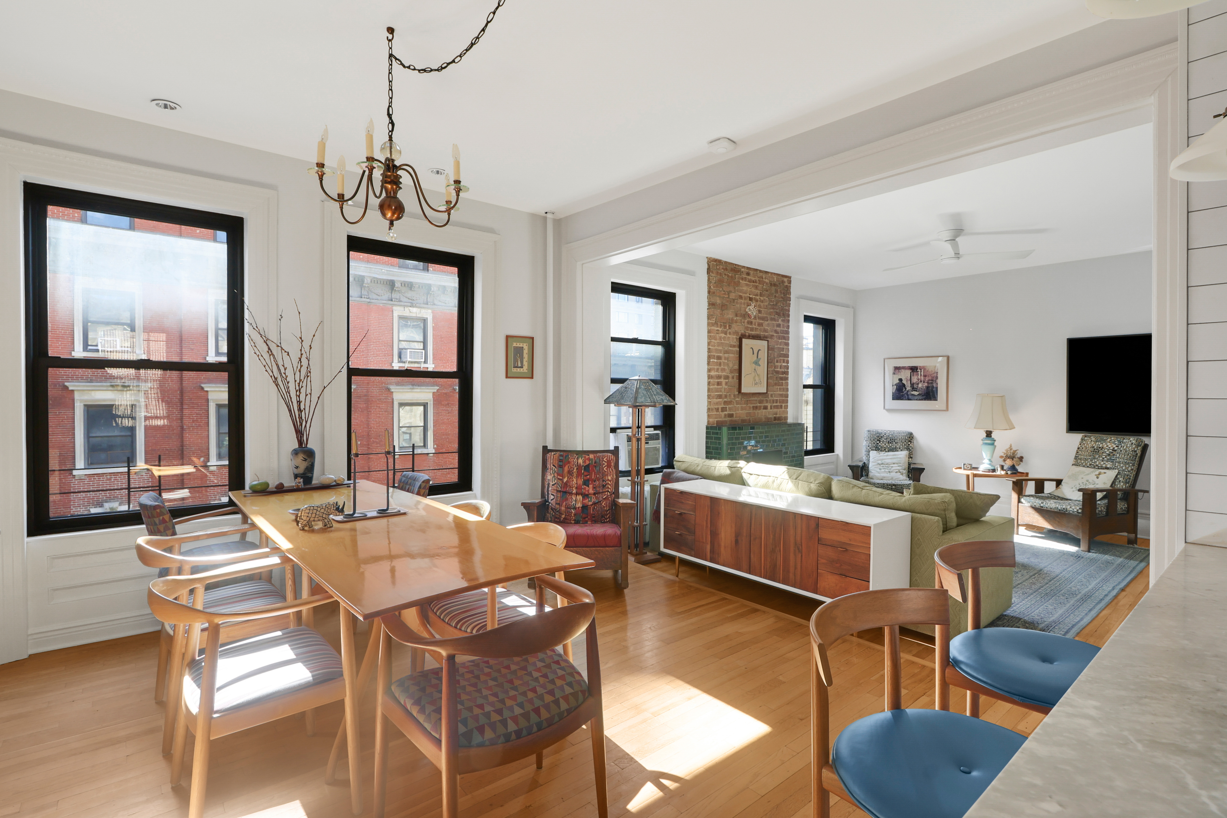 311 West 97th Street, Unit 6E Manhattan, NY 10025 - Photo 4 of 18 a living room with fireplace furniture and a large window