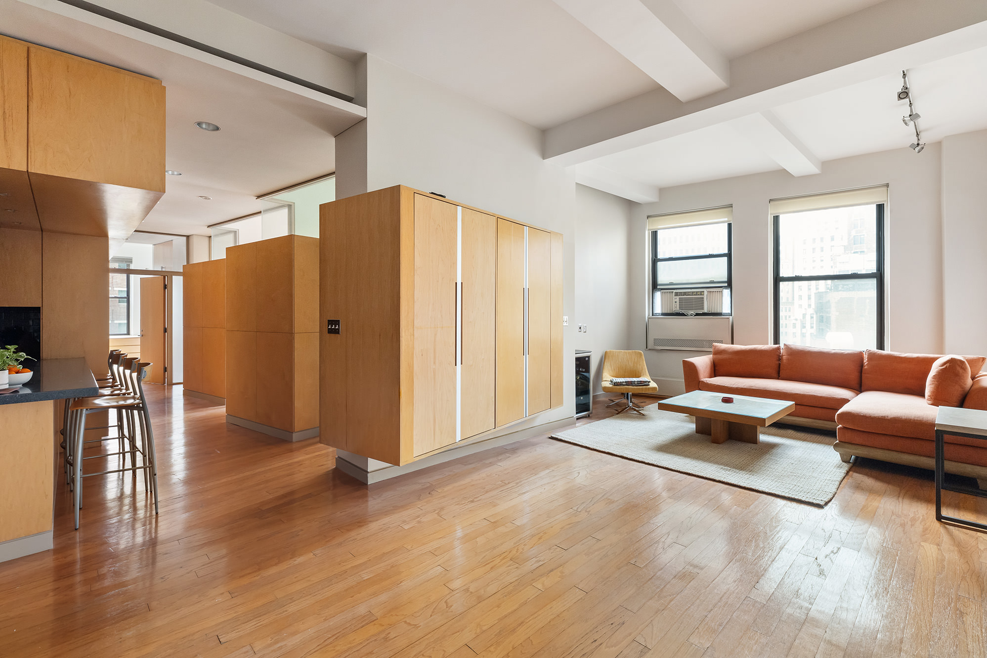 3 Hanover Square, Unit 14EF Manhattan, NY 10004 - Photo 2 of 14 a living room with furniture and a large window