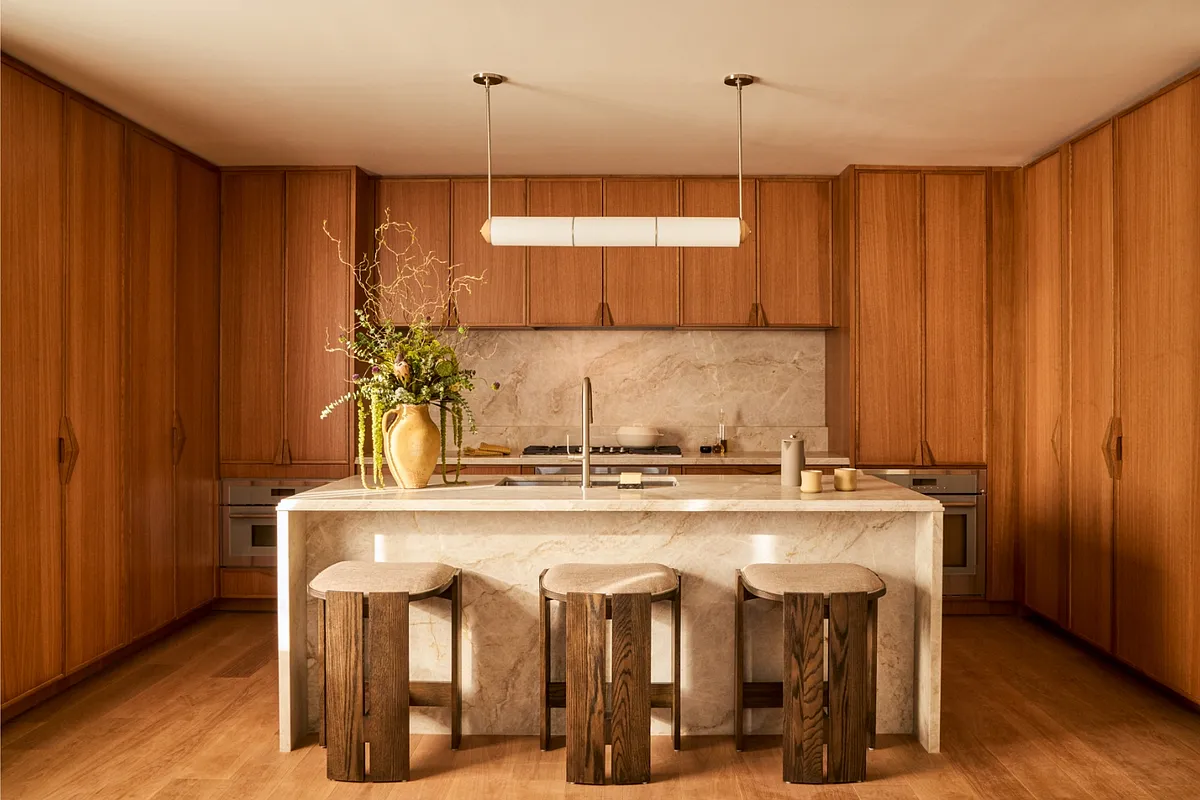 a kitchen with a table and chairs in it