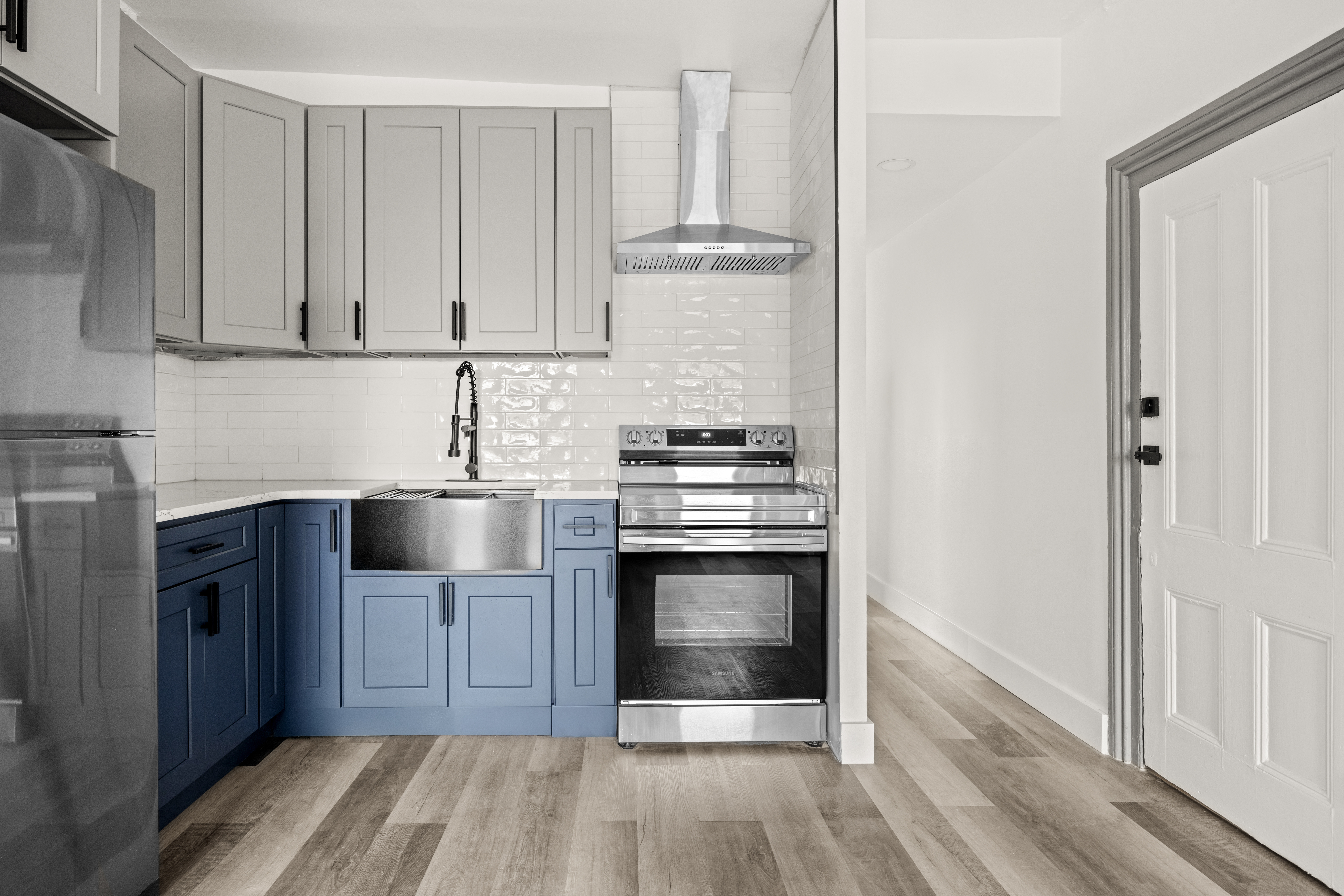 126 Quincy Street, Unit 3 Brooklyn, NY 11216 - Photo 5 of 11 a kitchen with stainless steel appliances granite countertop a stove and a refrigerator with white cabinets
