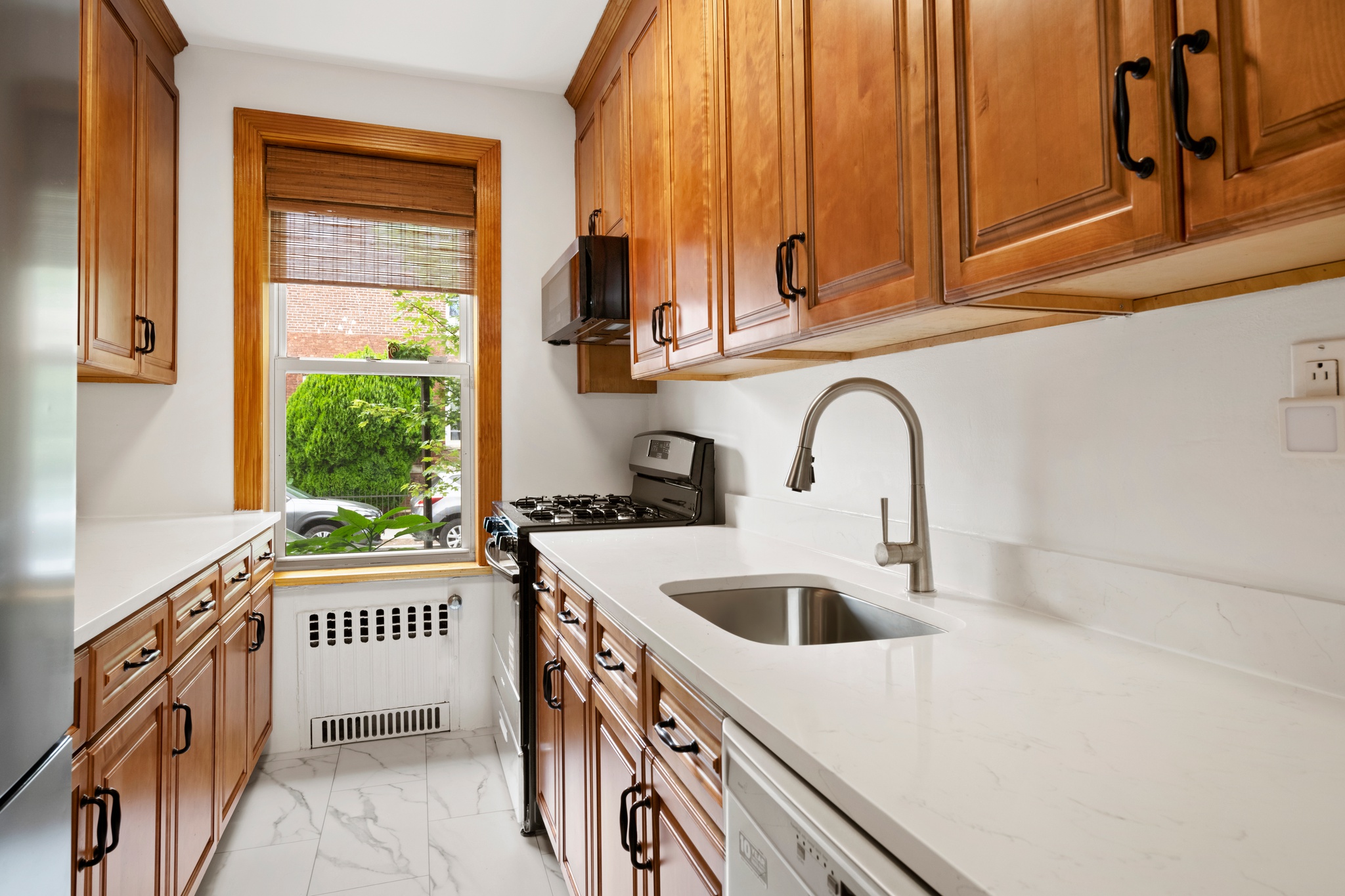 95 Chester Avenue, Unit 1 Brooklyn, NY 11218 - Photo 3 of 13 a kitchen with a sink and a window