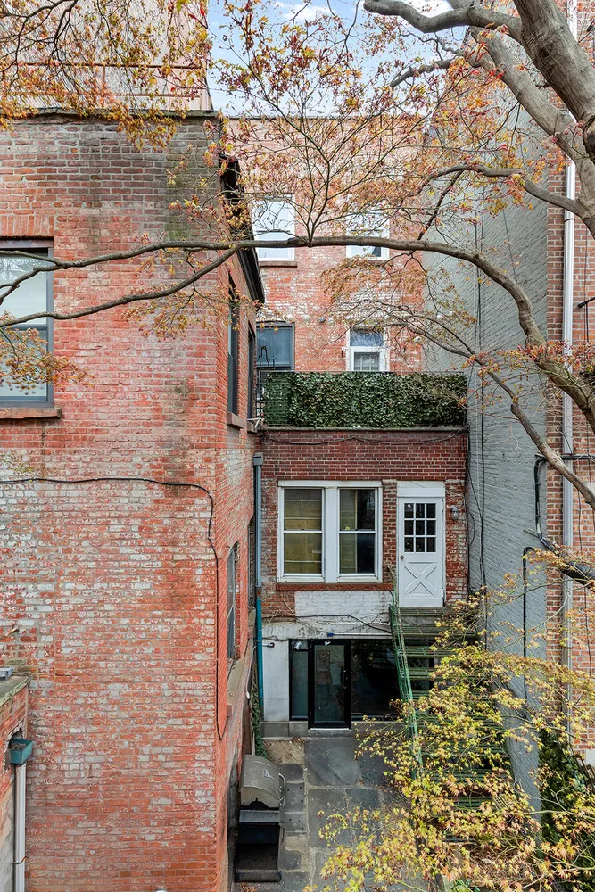 a view of a house with a small yard