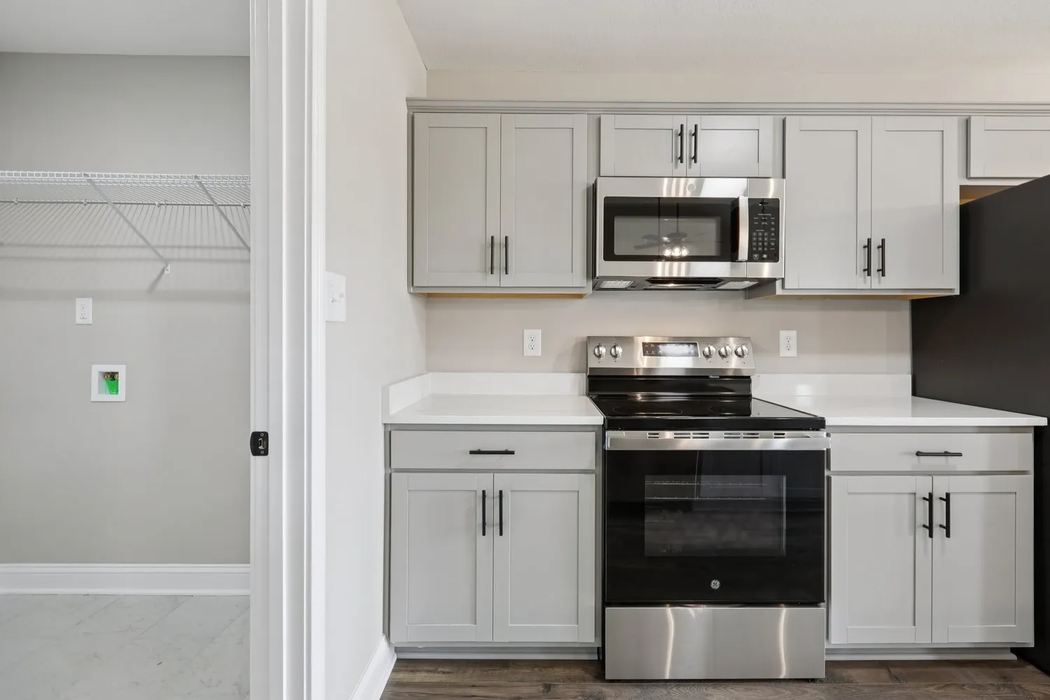 a kitchen with cabinets and stainless steel appliances