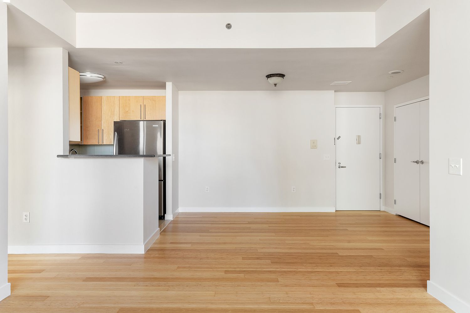 40 West 116th Street, Unit A808 Manhattan, NY 10026 - Photo 1 of 19 a view of a kitchen with wooden floor