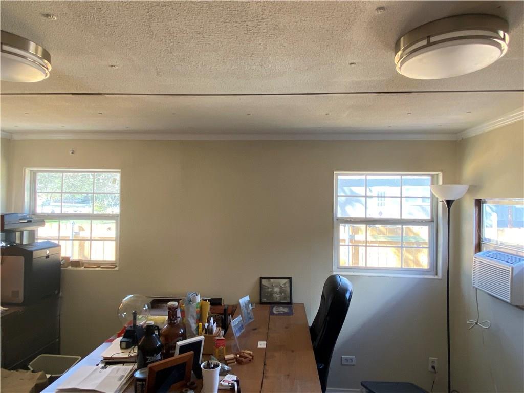 8518 Ranch To Market Road 1826 Austin, TX 78737 - Photo 17 of 17 a view of a workspace with furniture and a window