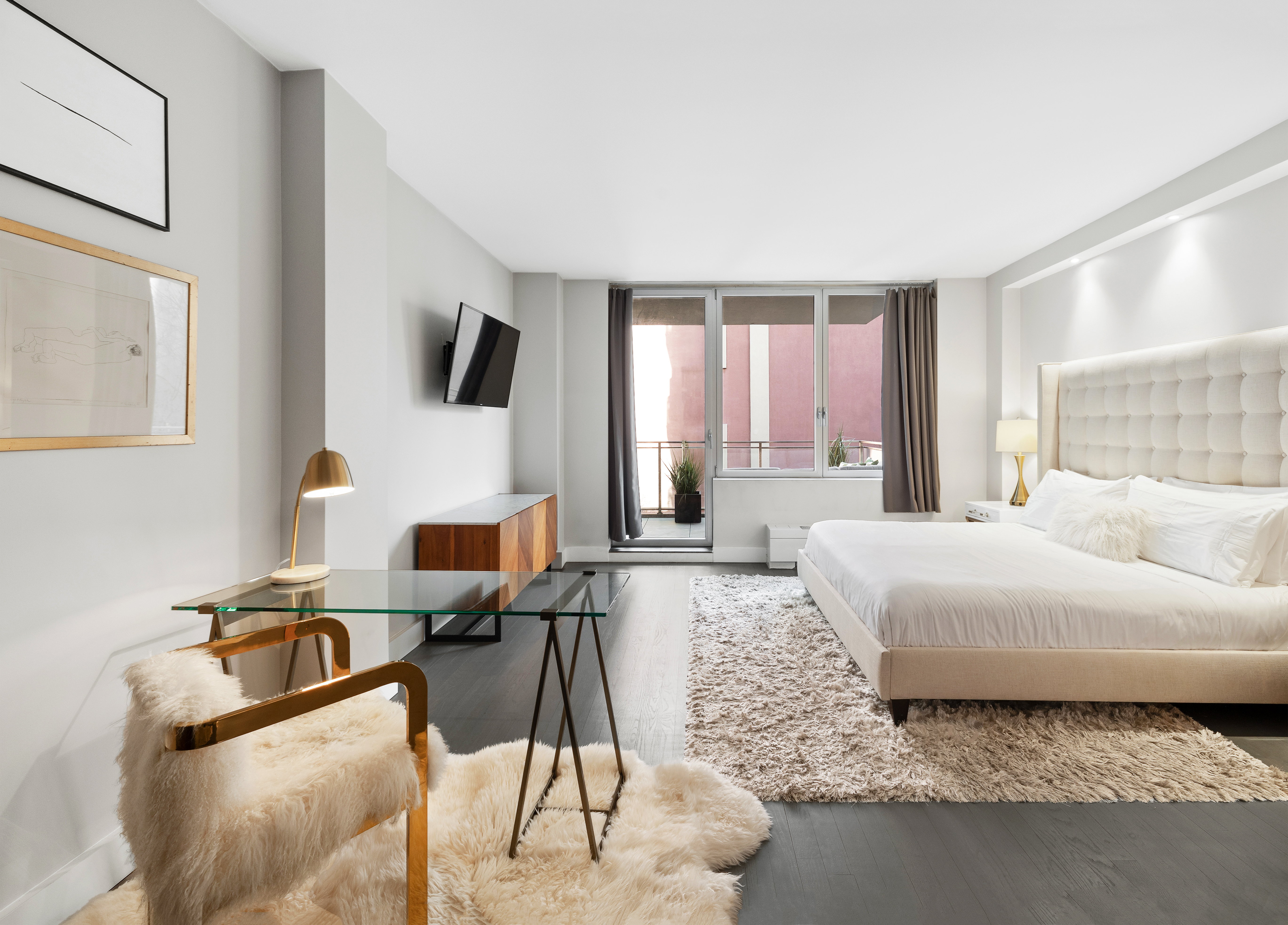 129 West 123rd Street, Unit 3 Manhattan, NY 10027 - Photo 7 of 20 a living room with furniture and a flat screen tv