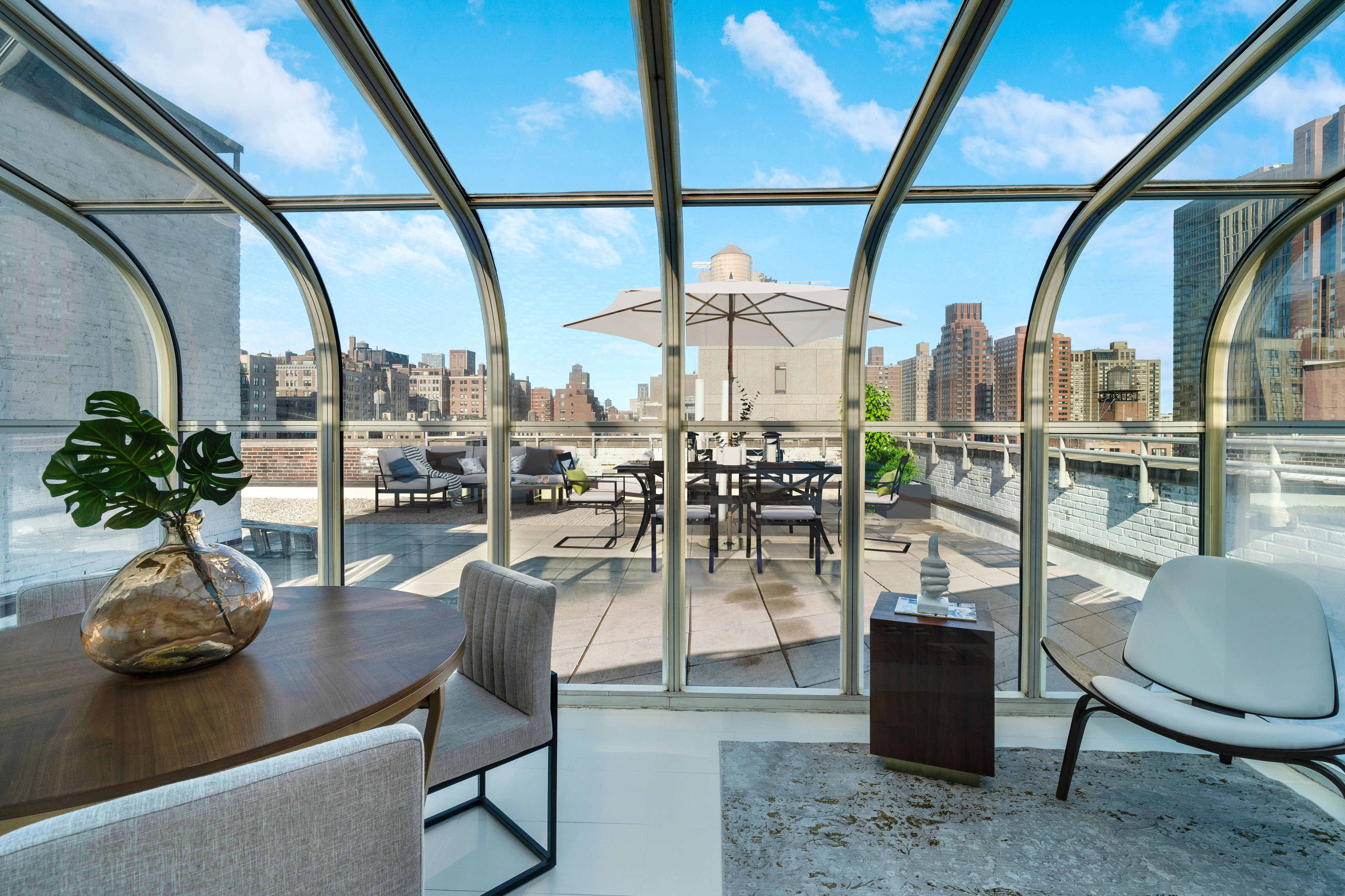 1349 Lexington Avenue, Unit PH2 Manhattan, NY 10128 - Photo 5 of 18 a dining room with furniture and a potted plant