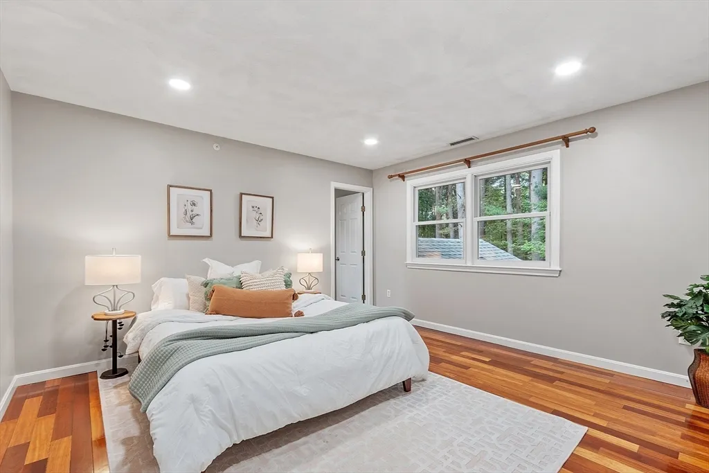 a bedroom with bed and window