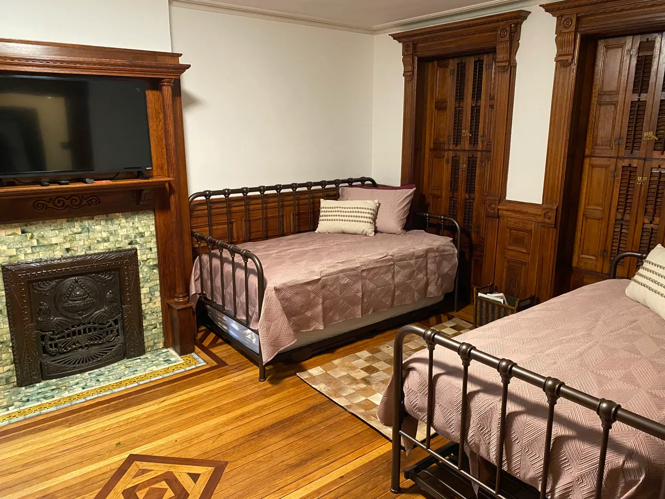 a bedroom with a bed and flat screen tv