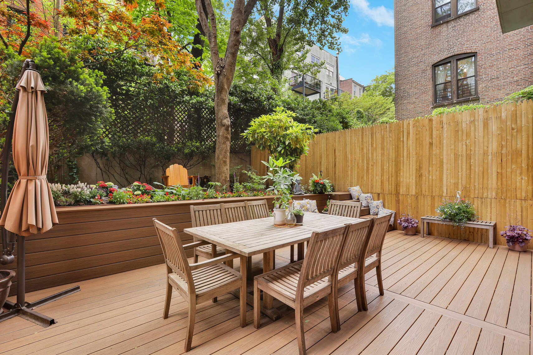 a view of an outside dining space with furniture