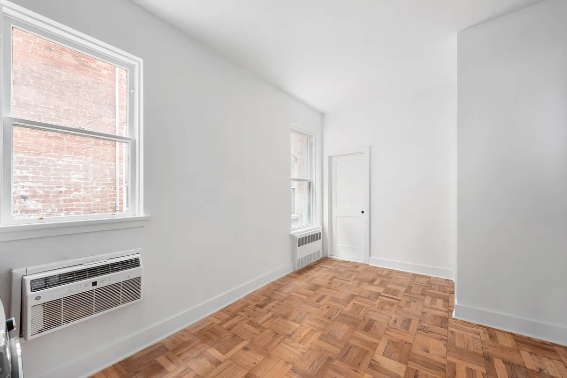 151 West 80th Street, Unit 4F Manhattan, NY 10024 - Photo 5 of 8 a view of a kitchen with wooden floor and natural light