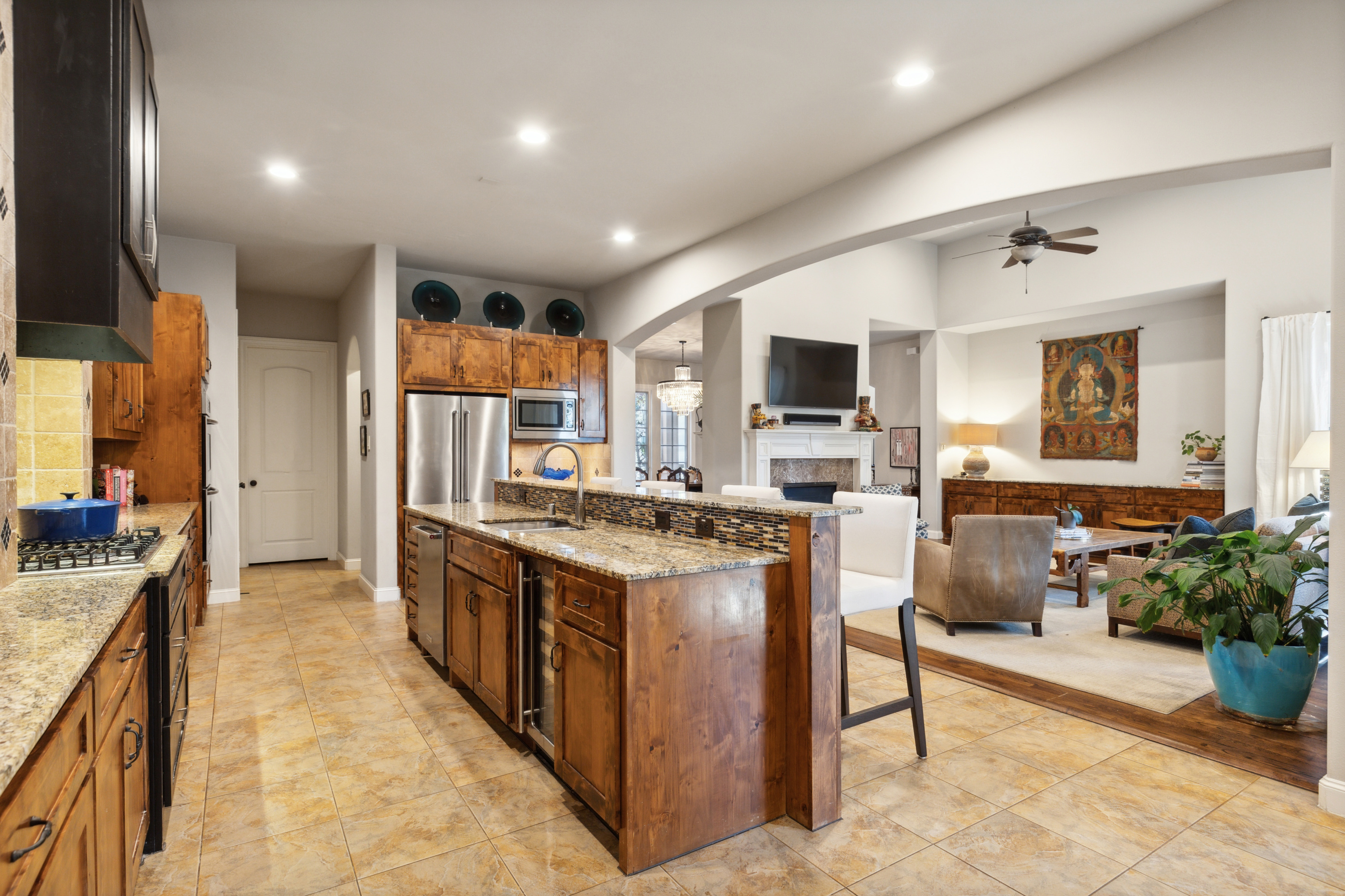8411 Midway Road Dallas, TX 75209 - Photo 16 of 29 a kitchen with stainless steel appliances granite countertop a stove oven and a refrigerator