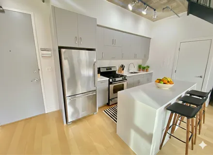 a kitchen with stainless steel appliances a refrigerator a stove a sink dishwasher and a refrigerator