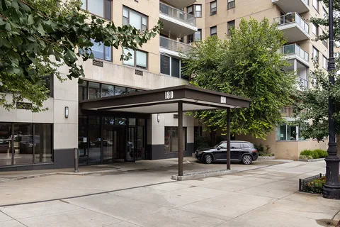 a lobby with furniture and floor to ceiling window