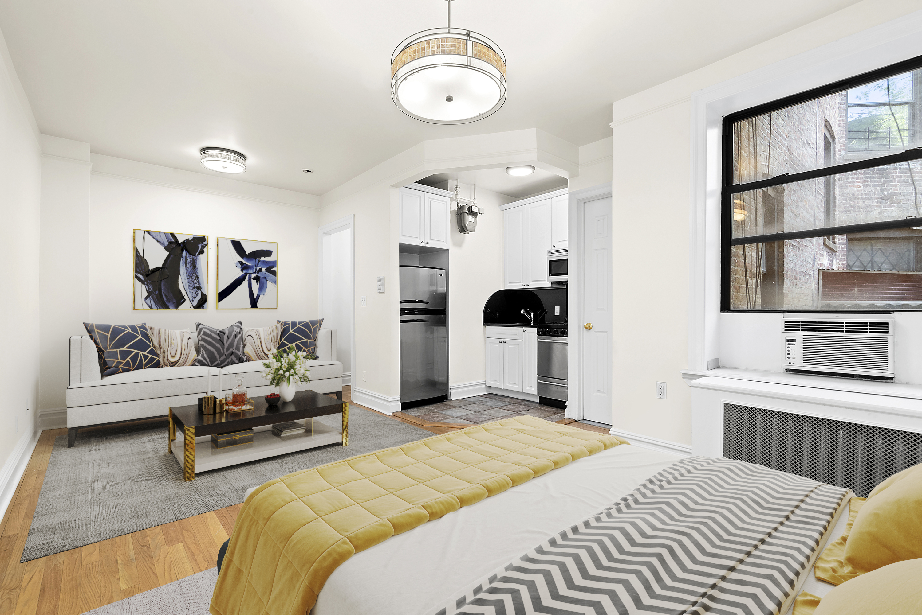 680 Riverside Drive, Unit 1E Manhattan, NY 10031 - Photo 2 of 6 a bedroom with a bed furniture and a large window